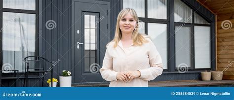 Blonde Real Estate Agent Standing Against New House Offer Stock Image Image Of Mansion