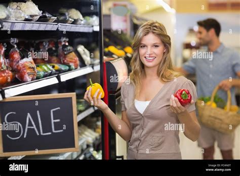 Portrait Of A Smiling Pretty Blonde Woman Buying Vegetables Stock Photo Alamy