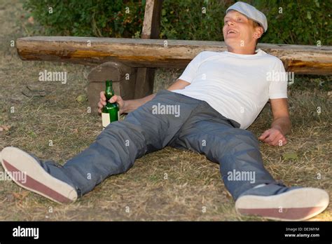 Drunk man lying on ground hi-res stock photography and images - Alamy