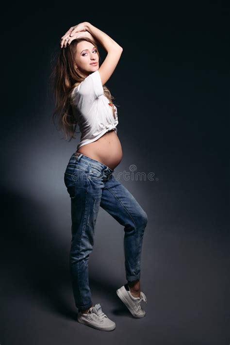 Gorgeous Expectant Mother With Naked Tummy Blowing Kiss Stock Photo Image Of Feeling Jeans