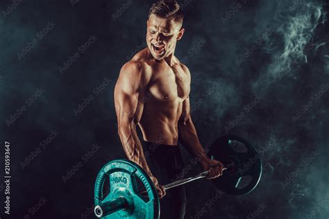 Athletic Man Doing Exercises With Heavy Barbell At Biceps Photo Of Strong Male With Naked Torso