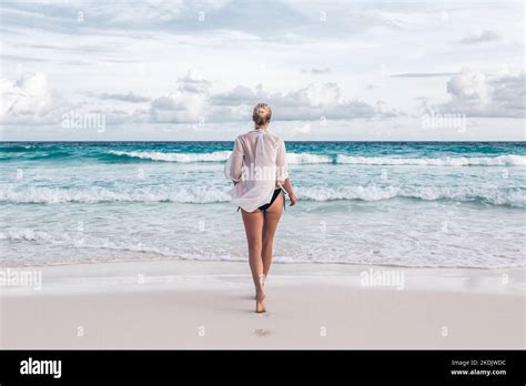 Woman Wearing White Loose Tunic Over Bikini On Mahe Island Seychelles Summer Vacations On