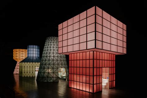 Hermès erects monumental water tower structures that glow like lanterns