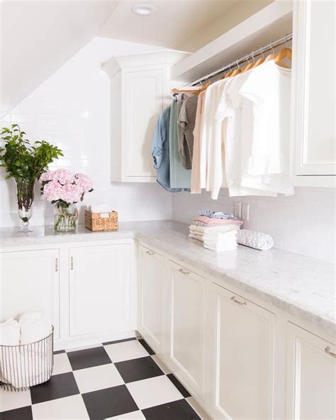 White Laundry Room With Black And White Checkered Floor Tiles