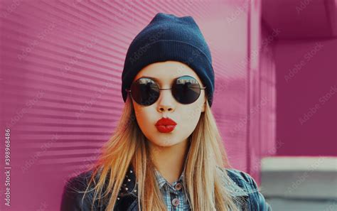 Portrait Of Stylish Beautiful Blonde Woman Blowing Red Lips Sending