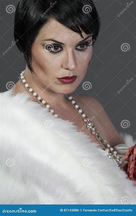 Flapper 1920s Style Brunette Dancer With Short Hair And Jewelry Stock