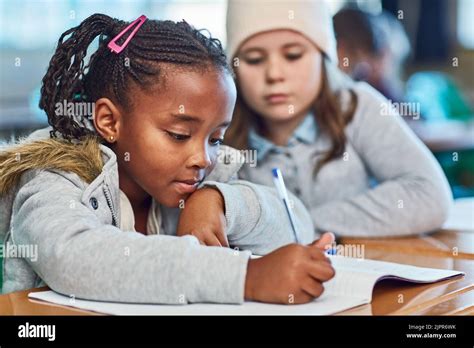 Learning From Each Other Elementary School Girls Doing School Work