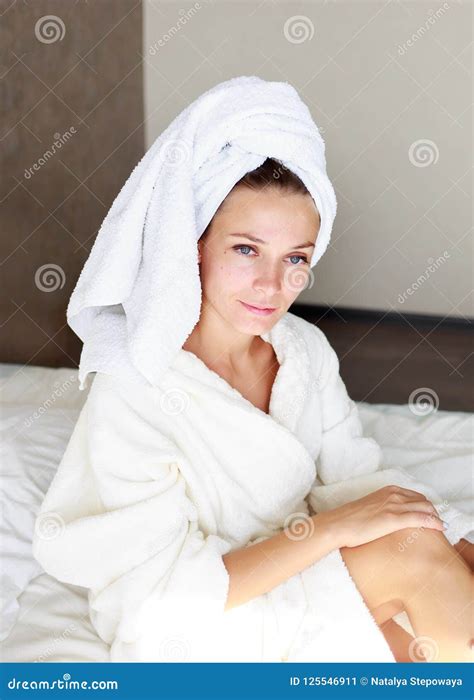 Beautiful Brunette Girl With A Towel On Her Head In Bed She Was Taking A Shower Stock Image