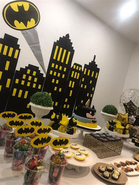 A Batman Themed Party With Cupcakes And Desserts