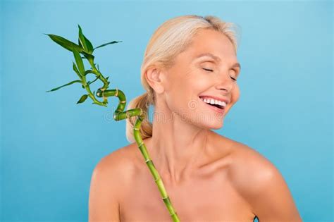 Photo Of Positive Cheerful Elderly Lady Naked Shoulders Closed Eyes