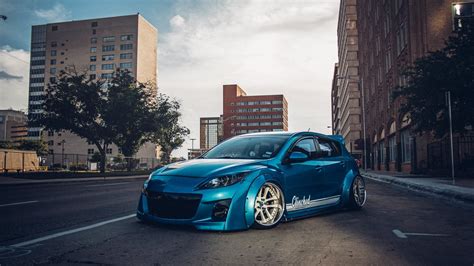 Extremely Exotic Clinched Body Kit On Blue Mazda 3 Gallery