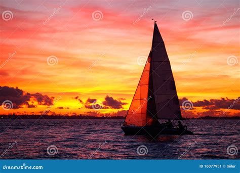 Yacht sailing at sunset stock image. Image of side, transportation ...