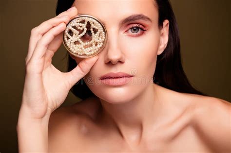 Photo Of Stunning Lovely Lady Naked Shoulders Hand Hold Jar With Pearls Isolated On Brown