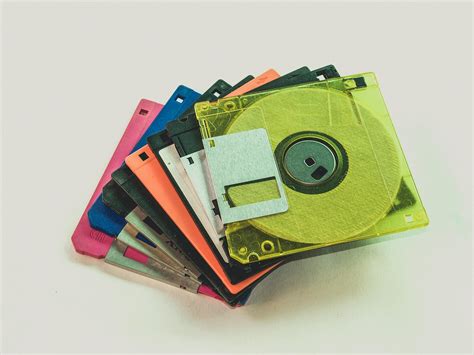 Floppy Disk Lot on White Surface · Free Stock Photo