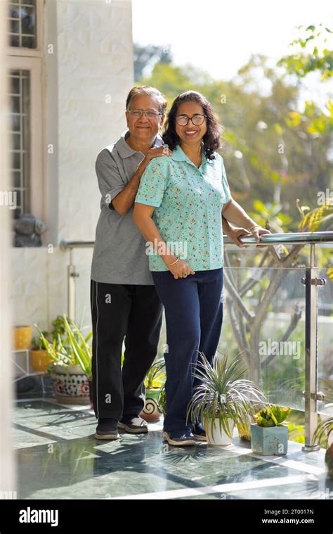 Portrait Of Happy Mature Couple Standing In Backyard Stock Photo Alamy