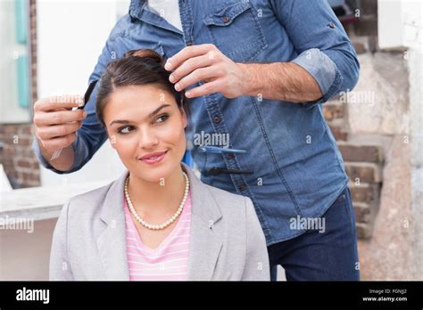 Pretty Brunette Getting Her Hair Styled Stock Photo Alamy