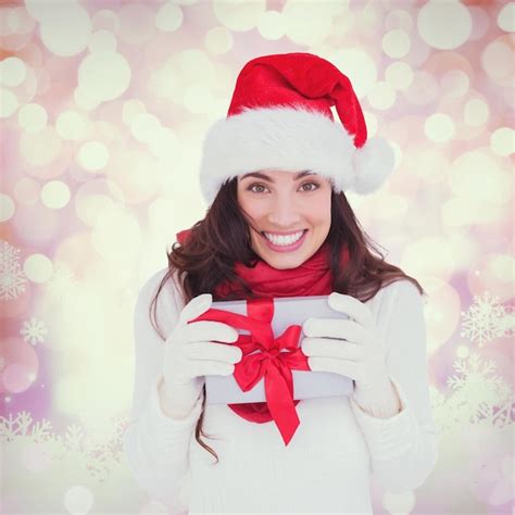 Premium Photo Composite Image Of Festive Brunette In Santa Hat
