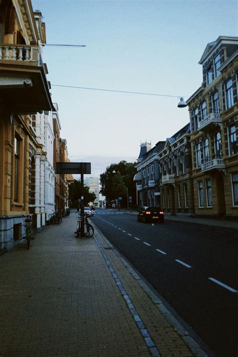 people walking  sidewalk  buildings  stock photo