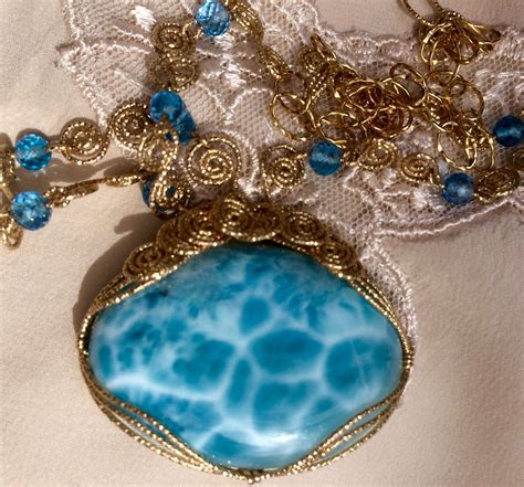 Gorgeous Larimar Cabochon Wrapped In Decorative Gold Filled Wire With