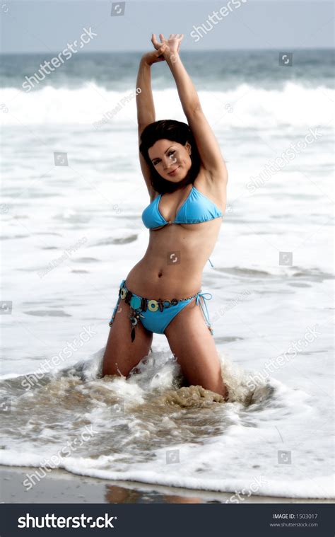 Beautiful Latina Woman On The Beach In A Blue Bikini Stock Photo 1503017 Shutterstock