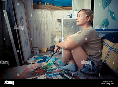 Beautiful Blonde Woman Painter In Her Studio Stock Photo Alamy