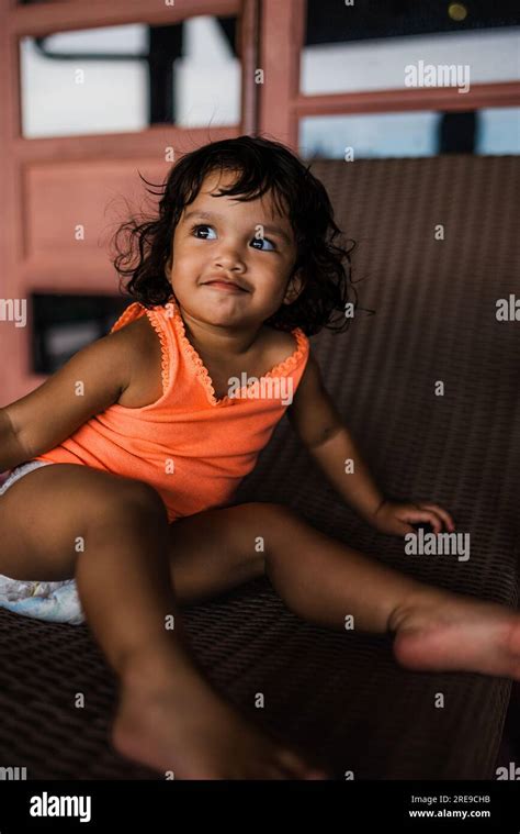 Baby Girl Playful At Home Stock Photo Alamy