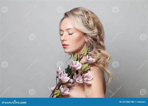 Healthy Woman Model With Clean Skin Light Nude Make Up Closed Eyes And Curly Blonde Hairstyle