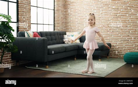 Adorable Blonde Girl Ballerina Smiling Confident Dancing At Home Stock Photo Alamy