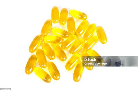 Yellow Gel Caps On White Stock Photo Download Image Now Capsule
