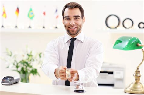 Premium Photo Happy Receptionist Working In Hotel