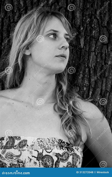 Grayscale Photo Of A Blonde Girl Leaning Against A Tree Stock Photo Image Of Healthy Catch