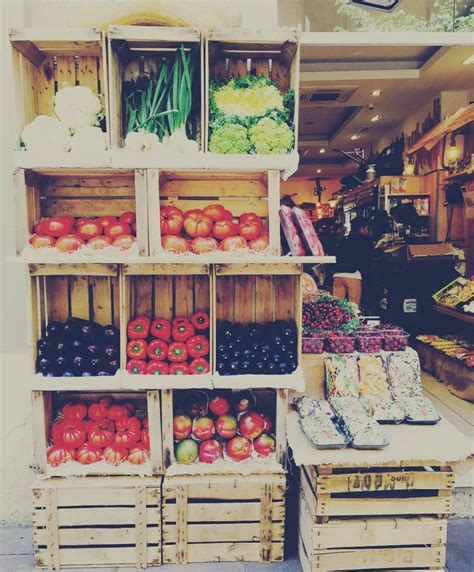 Crates Filled With Assorted Fruits And Vegetables On Top Of Each Other