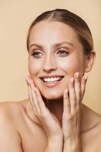Woman Posing Naked Isolated Over Beige Wall Background Stock Photo By Vadymvdrobot