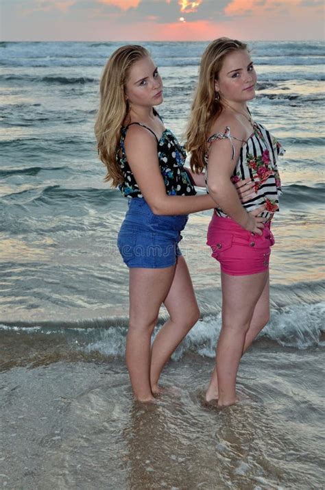 Two Girls Blonde On The Beach At Sunset Stock Photo Image Of Surf Sisters 22632756