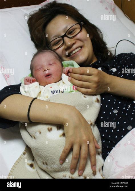 Fukushima Japan Tomoko Watanabe 20 Holds Her Son Who Was Born On