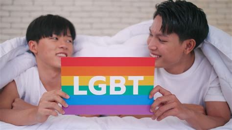 Premium Photo Happy Gay Asian Couple Showing Their Love With Rainbow Flag