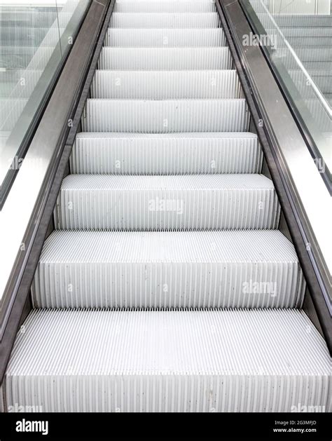 Escalator in an airport Stock Photo - Alamy