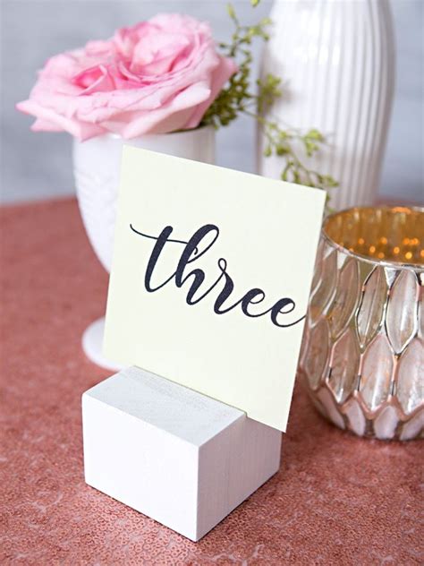 We Re LOVING These DIY Wood Block Table Number Stands Table Number