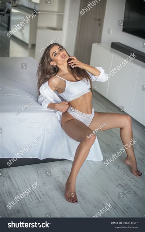 Attractive Sexy Brunette White Lingerie Posing Stock Photo
