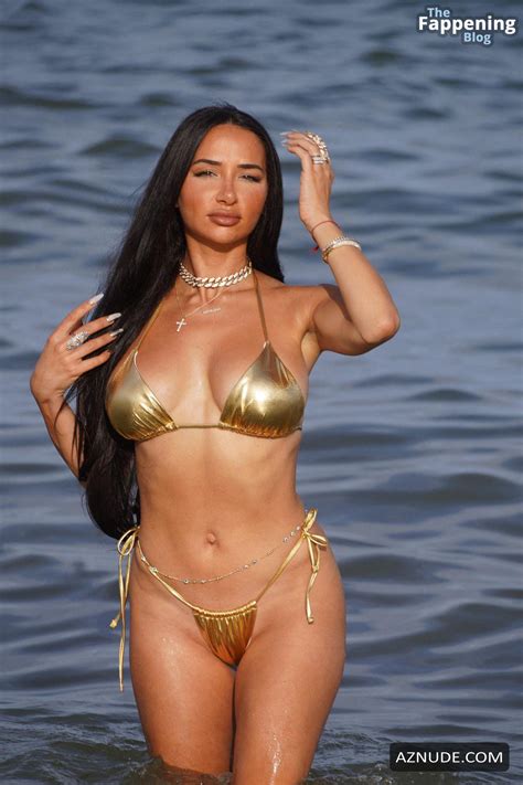 Natasha Graziano Flaunts Her Sexy Figure In A Gold Bikini Aznude
