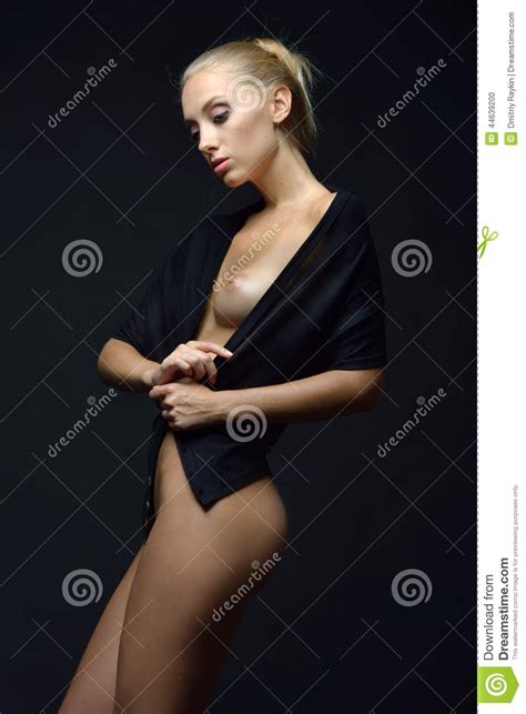 Beautiful Naked Blonde Woman In A Black Blouse Posing In A Dark Stock Photo Image Of Shirt