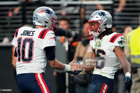 Mac Jones And Jakobi Meyers Of The New England Patriots Celebrate A