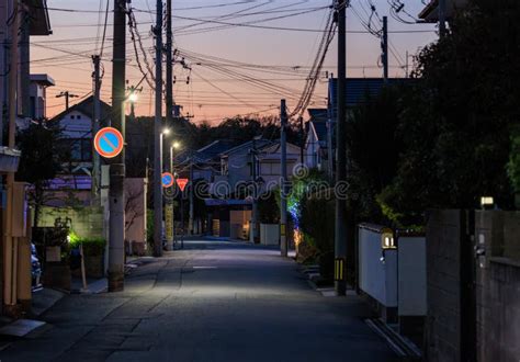 Quiet Street In Residential Neighborhood With Sunset Color In Sky Stock