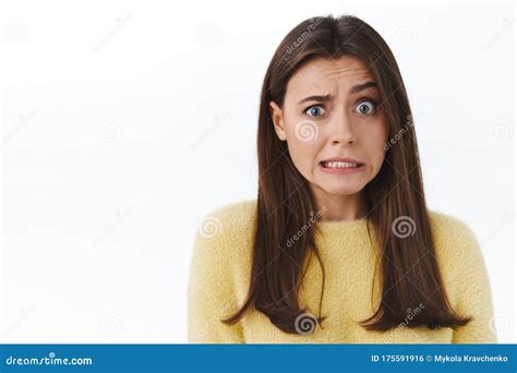 Awkward And Embarrassed Cute Brunette Girl Feel Concerned And Anxious About Something She Did