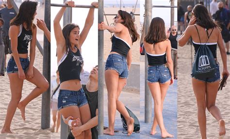 Cute Brunette In Short Jean Shorts Doing Pullups On The Sand Thecandidforum Voyeur