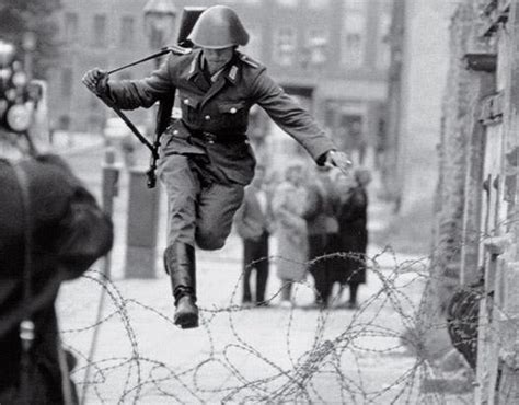 19 Year Old East German Border Guard Konrad Schumann Leaps Over The