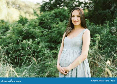 Pregnant Brunette Woman In The Park Stock Photo Image Of Abdomen Copyspace