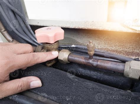 Checking for refrigerant gas leaks in outdoor HVAC systems. check oil