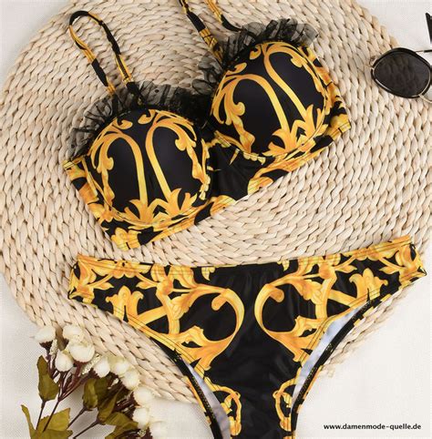 Bikinis und Badeanzüge Monokini Bikini in Schwarz mit Applikationen in Gold Damenmode