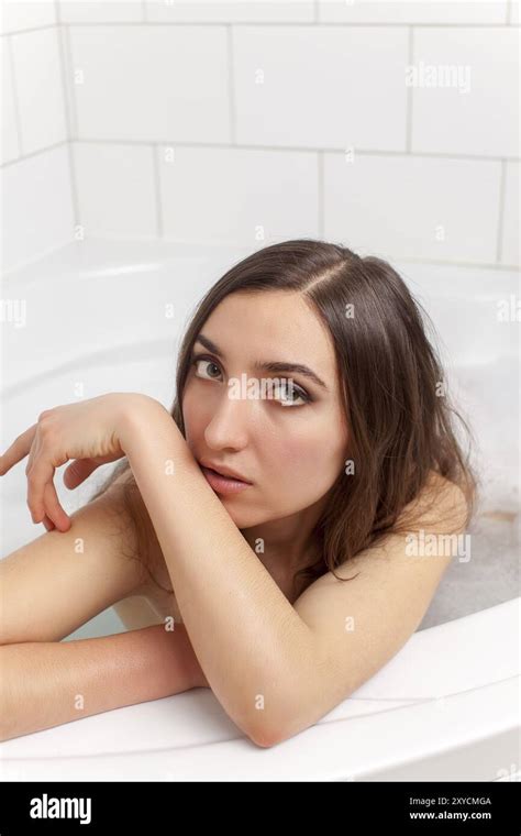 Attractive Brunette Woman In The Bathtub Stock Photo Alamy